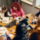 What Long Beach can teach communities about youth participatory budgeting_feature: group of young people collaborating around wooden table with laptops and charts