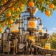 Low-hanging fruit_feature: image of complicated steam-punk style machine extracting juice from oranges on orange tree