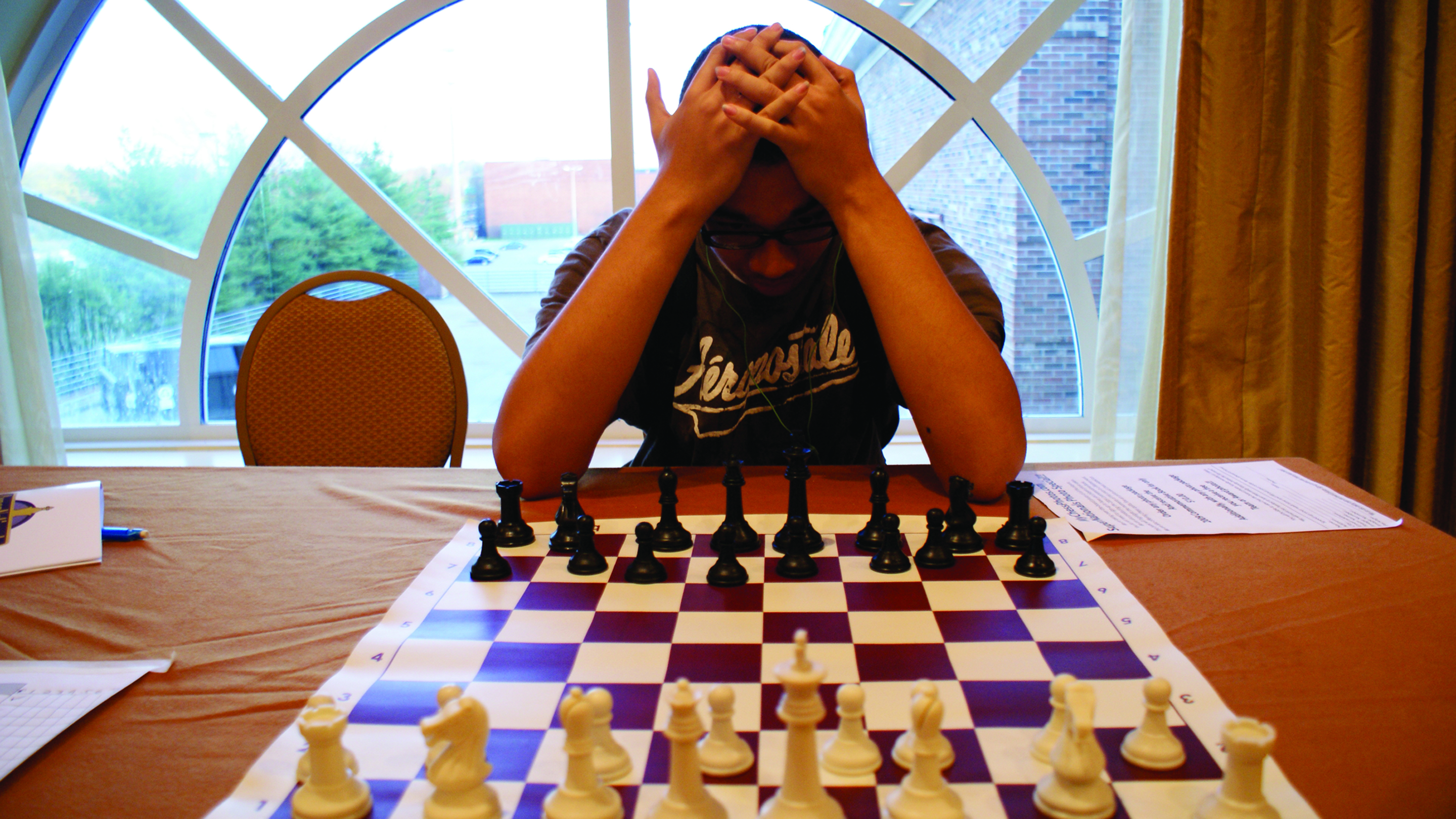 Laron McBryde carefully weighs his next move at the 2011 High School Nationals in Nashville, Tenn. Since 1986, Chess-in the-Schools, a New York City-based nonprofit, has worked with more than 400,000 young people and has achieved considerable success in getting its participants into college.