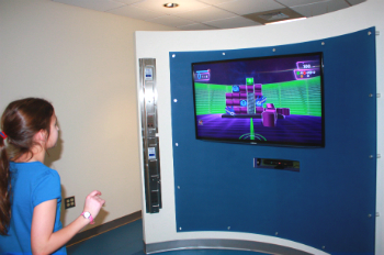 Sophia, a patient at the Complex, plays an interactive video game in the 