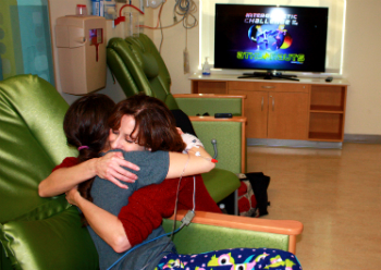 Dani, a patient at the Complex, is pain-free for the first time in over a year and able to hug her mom, Lori.