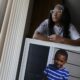 gun violence killing teens, children: young mother holding picture of dead son
